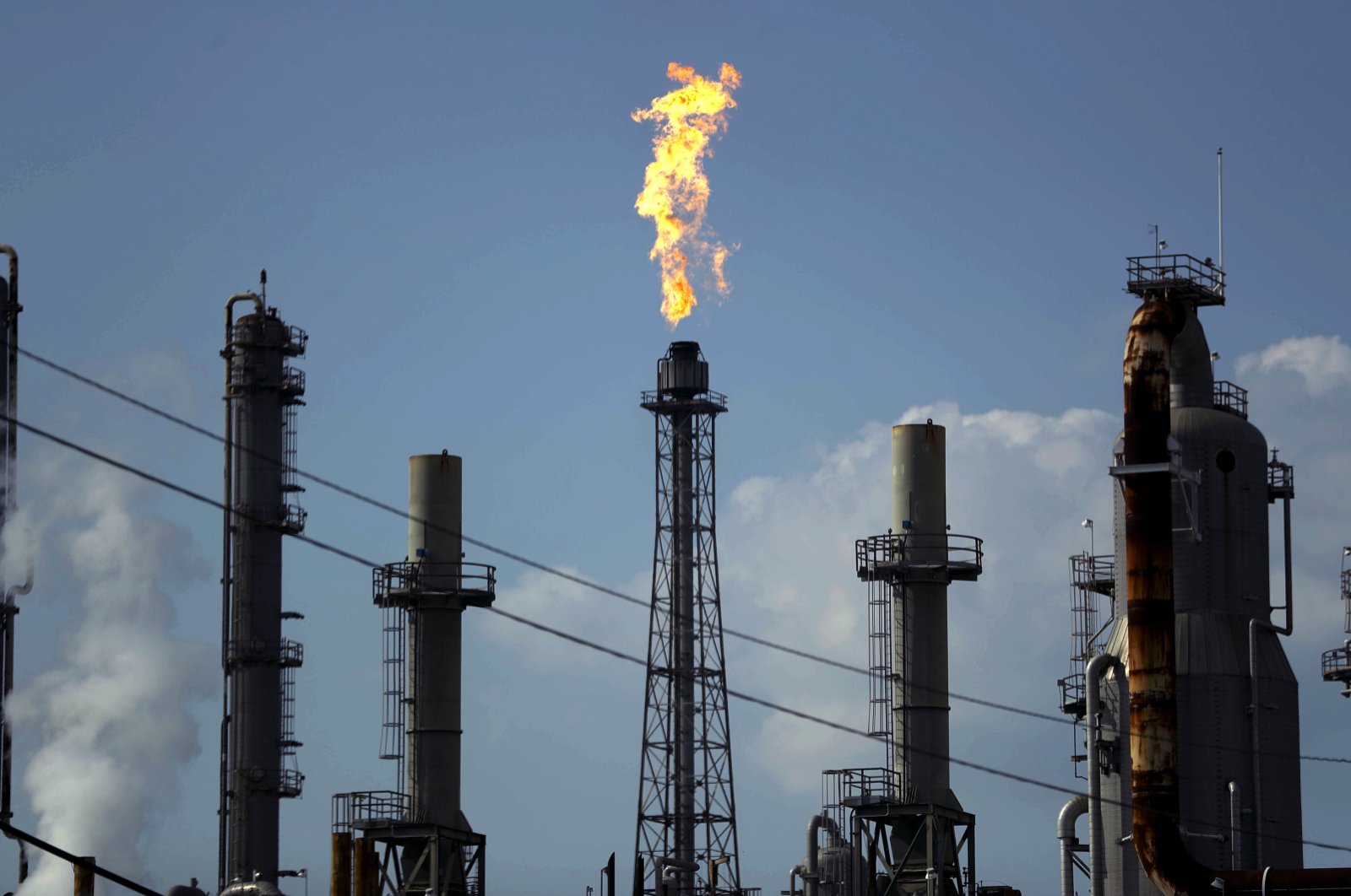 In this Thursday, Aug. 31, 2017, file photo, a flame burns at the Shell Deer Park oil refinery in Deer Park, Texas. (AP Photo)