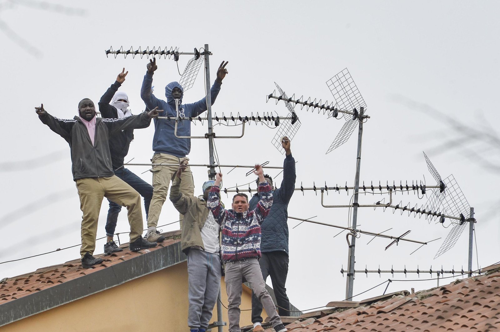 Detainees protest on the roofs of the San Vittore Prison in Milan, northern Italy, March 9, 2020. (EPA Photo)