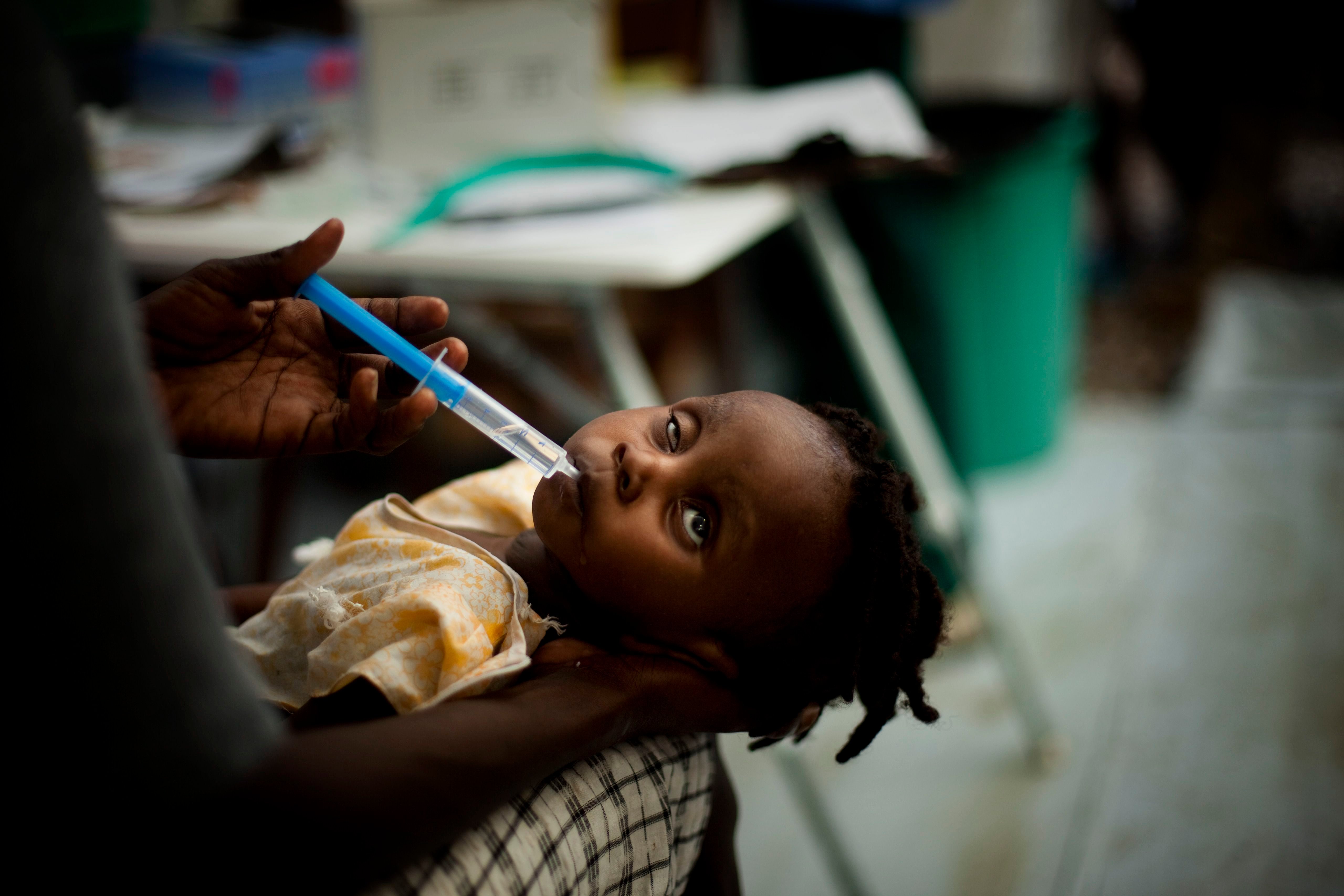 In this Nov. 12, 2010 file photo, a girl suffering cholera symptoms receives treatment at the Doctors Without Borders temporary hospital in Port-au-Prince, Haiti. (AP Photo)