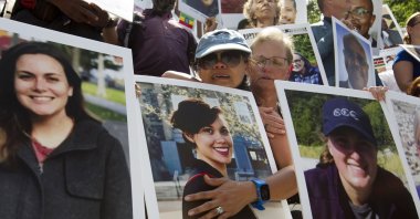 Mothers Clariss Moore (L) and Joana Vincent hold the pictures of their daughters during a vigil on the six-month anniversary of the crash of a Boeing 737 Max 8, Washington, D.C., Sept. 10, 2019. (AP Photo)