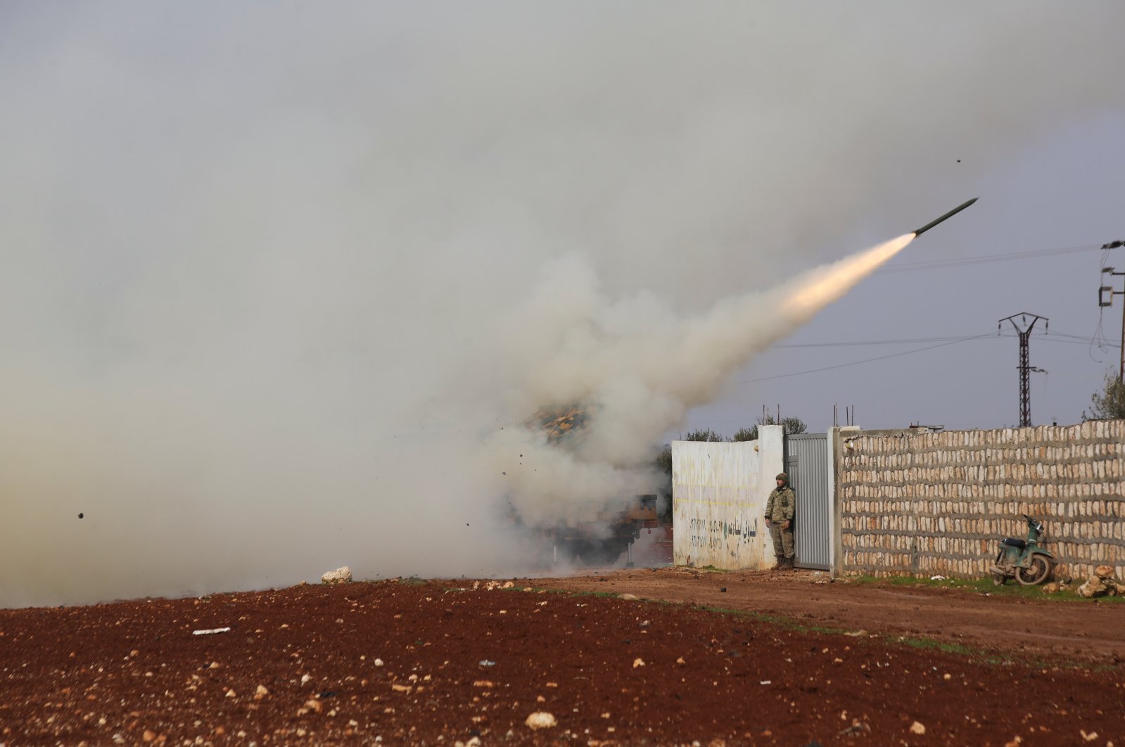 Turkish soldiers fire a missile at Assad regime position in the province of Idlib, Syria, Friday, Feb. 14, 2020. (AP Photo)