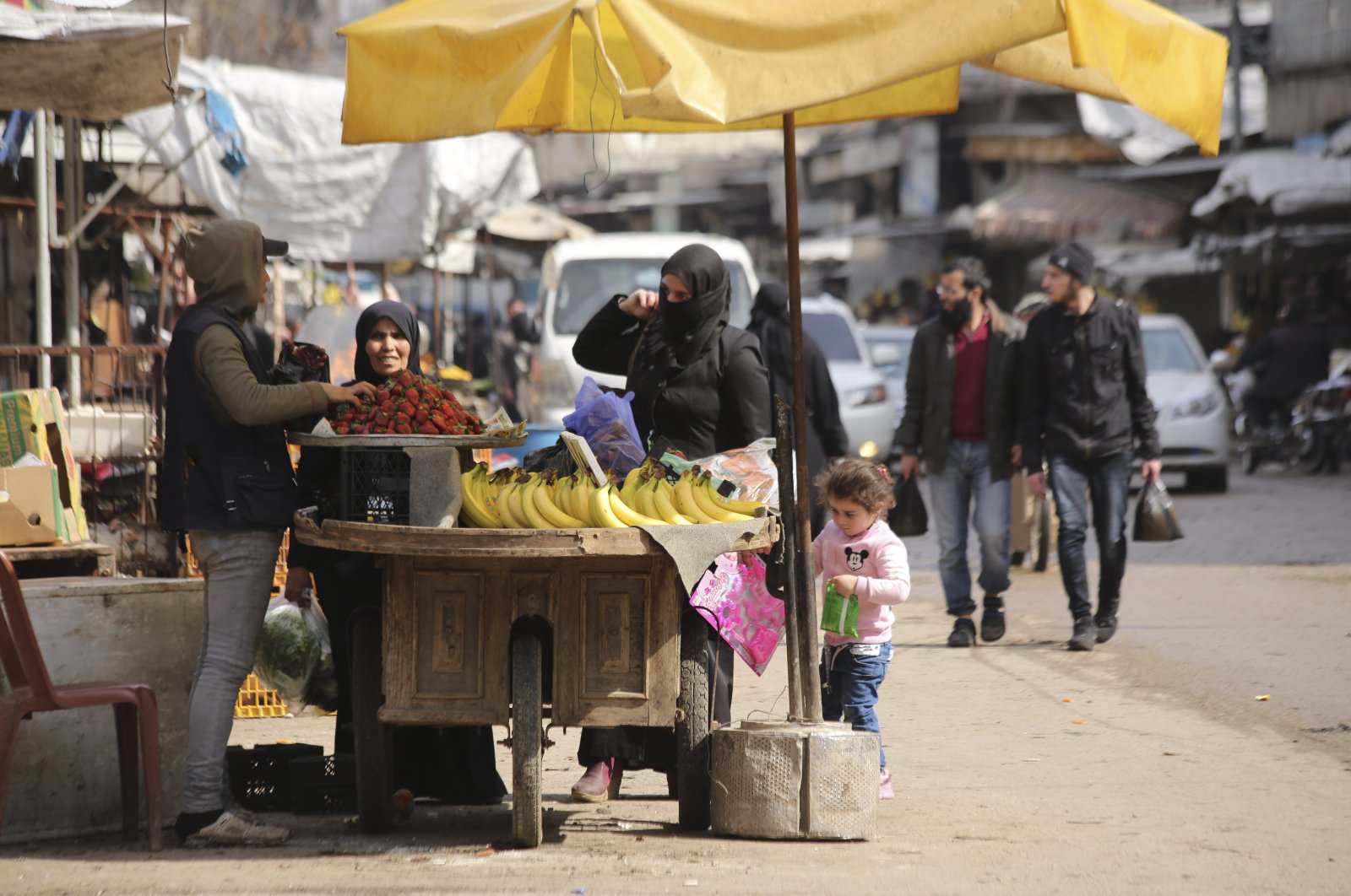 People shop in the city of Idlib, Syria, March 9, 2020, during the truce brokered by Turkey and Russia. (AP Photo)