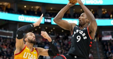 Toronto Raptors center Ibaka shoots the ball against Utah Jazz center Gobert during an NBA match in Salt Lake City, March 9, 2020. (Reuters Photo)