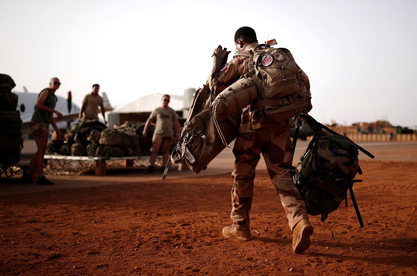 A French soldier leaves with his backpack at the Operational Desert Platform Camp (PfOD) during Operation Barkhane, Gao, Aug. 1, 2019. (Reuters Photo)