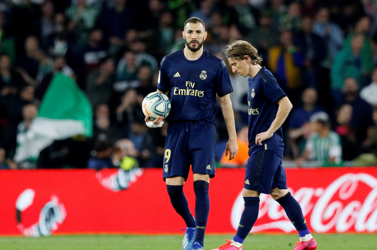Real Madrid's Karim Benzema and Luka Modric react after Real Betis' first goal during a La Liga match, March 8, 2020. (Reuters Photo)