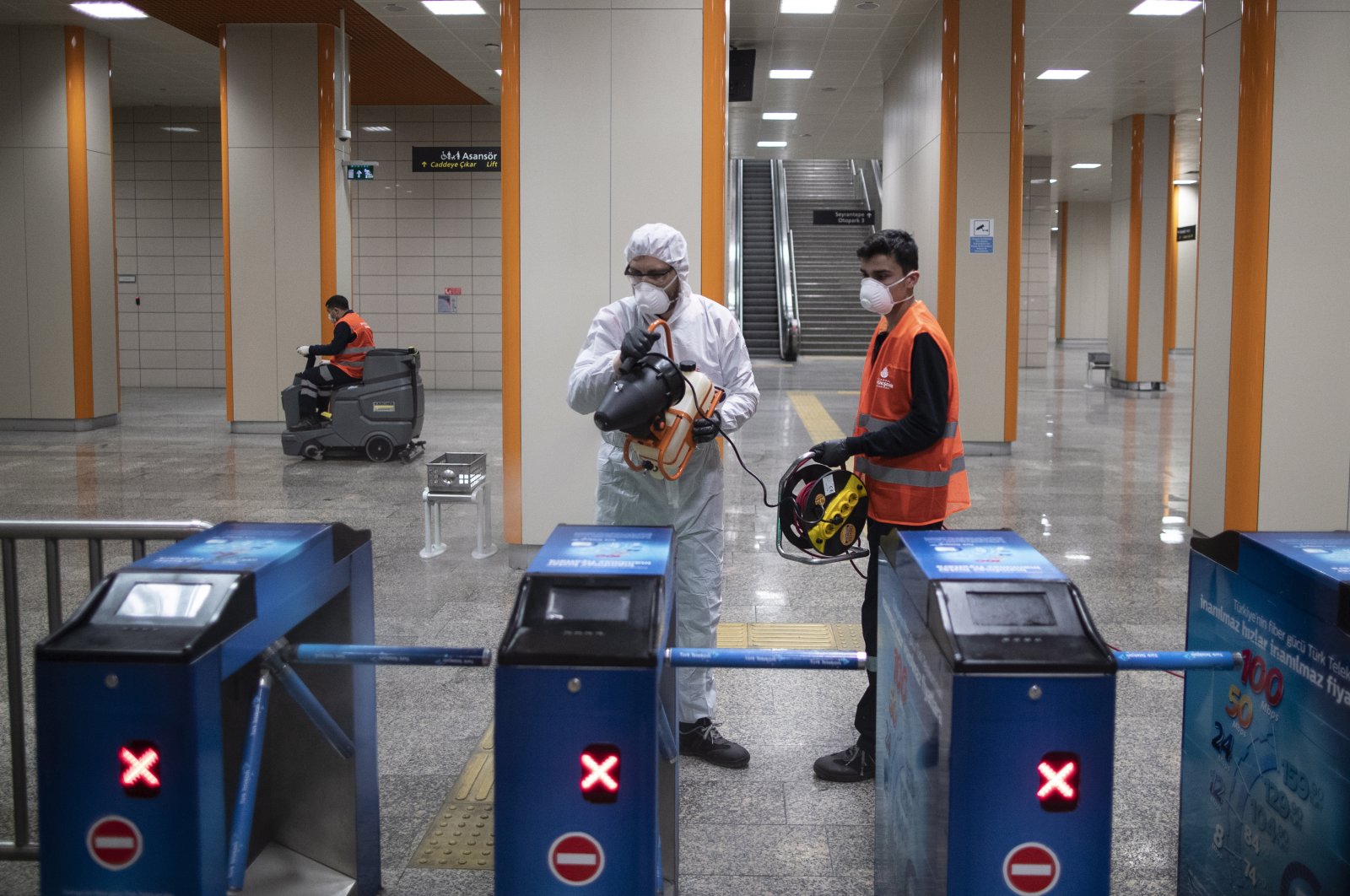 Employees of the Istanbul Metropolitan Municipality disinfects a metro station to prevent the spread of the novel coronavirus, COVID-19, in Istanbul, Wednesday, March 11, 2020. (EPA Photo)