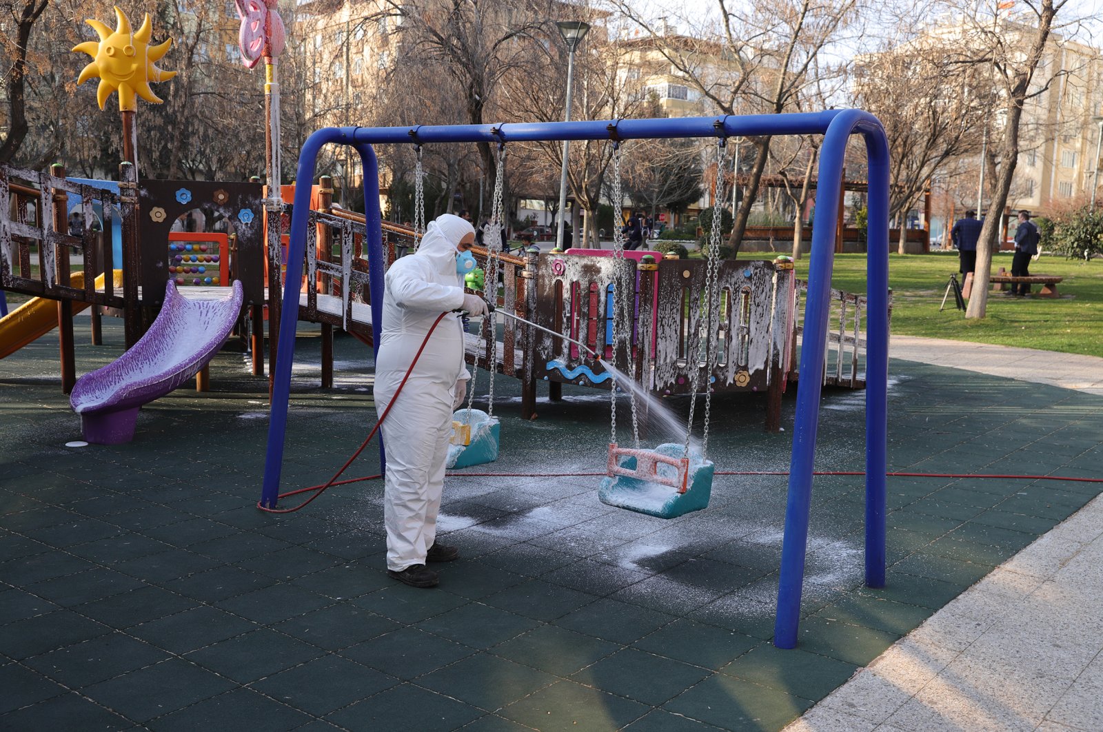 A worker disinfects a playground in Gaziantep, Thursday, March 12, 2020. (AA Photo)