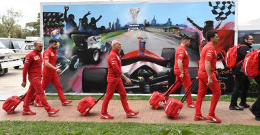 Members of the Ferrari team arrive to pack up their equipment after the Australian Grand Prix was canceled, Melbourne, March 13, 2020. (AFP Photo)