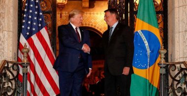 U.S. President Donald Trump shakes hands with Brazil's President Jair Bolsonaro at his Mar-a-Lago residency in Palm Beach, Florida, U.S., March 7, 2020, in this picture obtained from social media. (Reuters Photo)
