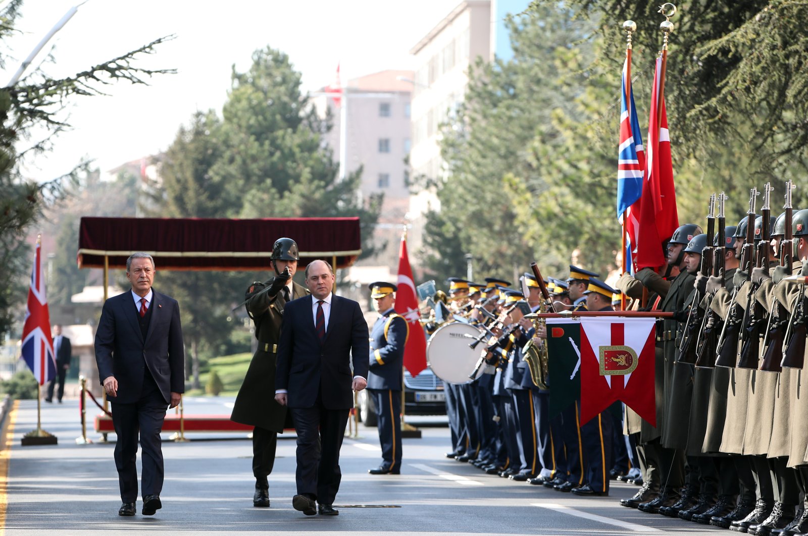 Defense Minister Hulusi Akar and his British counterpart Ben Wallace attend a military ceremony to welcome the delegation in Ankara, Thursday, March 12, 2020. (AA Photo)