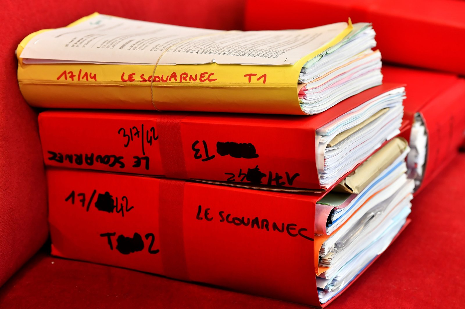 Files are displayed in the courtroom during the opening day of a French surgeon's trial for the rape and sexual abuse of four children, Saintes, March 13, 2020. (AFP Photo)