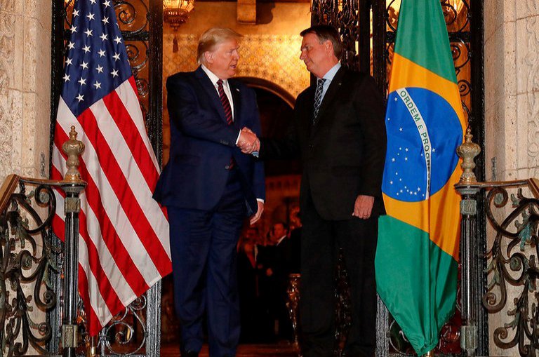 U.S. President Donald Trump shakes hands with Brazil's President Jair Bolsonaro at his Mar-a-Lago residency in Palm Beach, Florida, U.S., March 7, 2020, in this picture obtained from social media. (Reuters Photo)