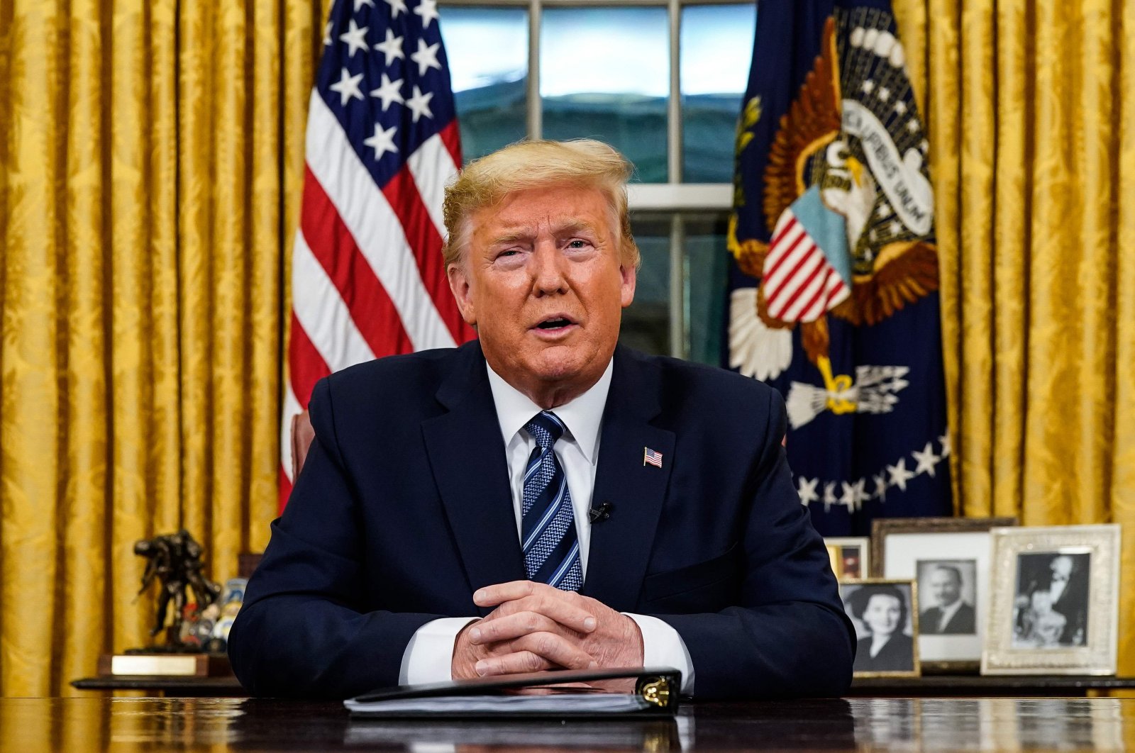 U.S. President Donald Trump addresses the nation from the Oval Office about the widening novel coronavirus crisis, in Washington, D.C. on March 11, 2020. (AFP Photo)