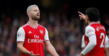 Arsenal's Shkodran Mustafi reacts as he is spoken to by teammate Hector Bellerin. (Reuters Photo)