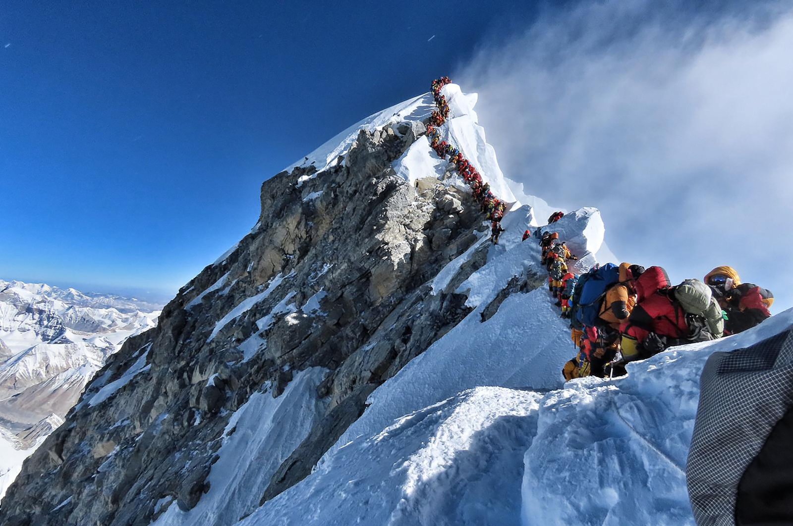 This handout photo taken on May 22, 2019 and released by climber Nirmal Purja's Project Possible expedition shows heavy traffic of mountain climbers lining up to stand at the summit of Mount Everest. (AFP Photo/Project Possible)