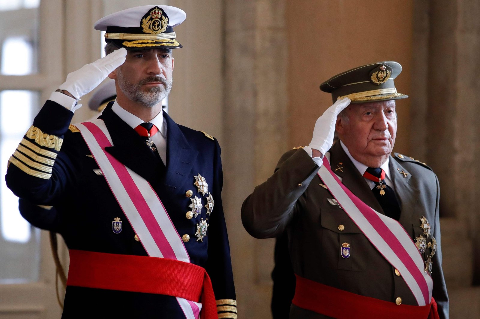 In this file photo taken Jan. 6, 2018, Spain's King Felipe VI (L) and his father King Emeritus Juan Carlos I salute during the Epiphany Day celebrations (Pascua Militar) at the Royal Palace in Madrid. (AFP Photo)