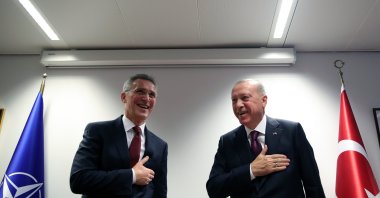 President Recep Tayyip Erdoğan (right) and NATO Secretary-General Jens Stoltenberg perform the traditional hands-free Turkish greeting following a meeting in Brussels on March 10, 2020. (AA Photo)