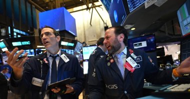 Traders work during the opening bell at the New York Stock Exchange, New York City, U.S., Monday, March 16, 2020. (AFP Photo)