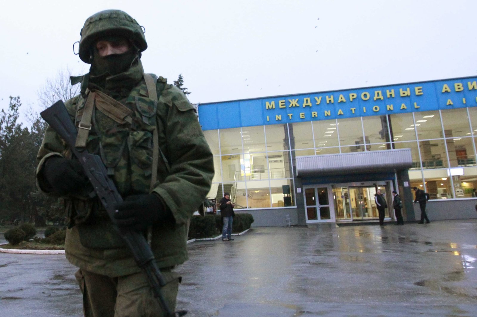 A Russian patrol stands at the international airport in Crimea. 