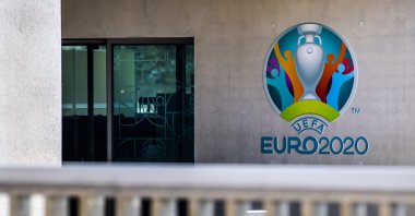 The Euro 2020 logo displayed next to the entrance of the UEFA Headquarters, in Nyon, Switzerland, Tuesday, March 17, 2020. (AP Photo)