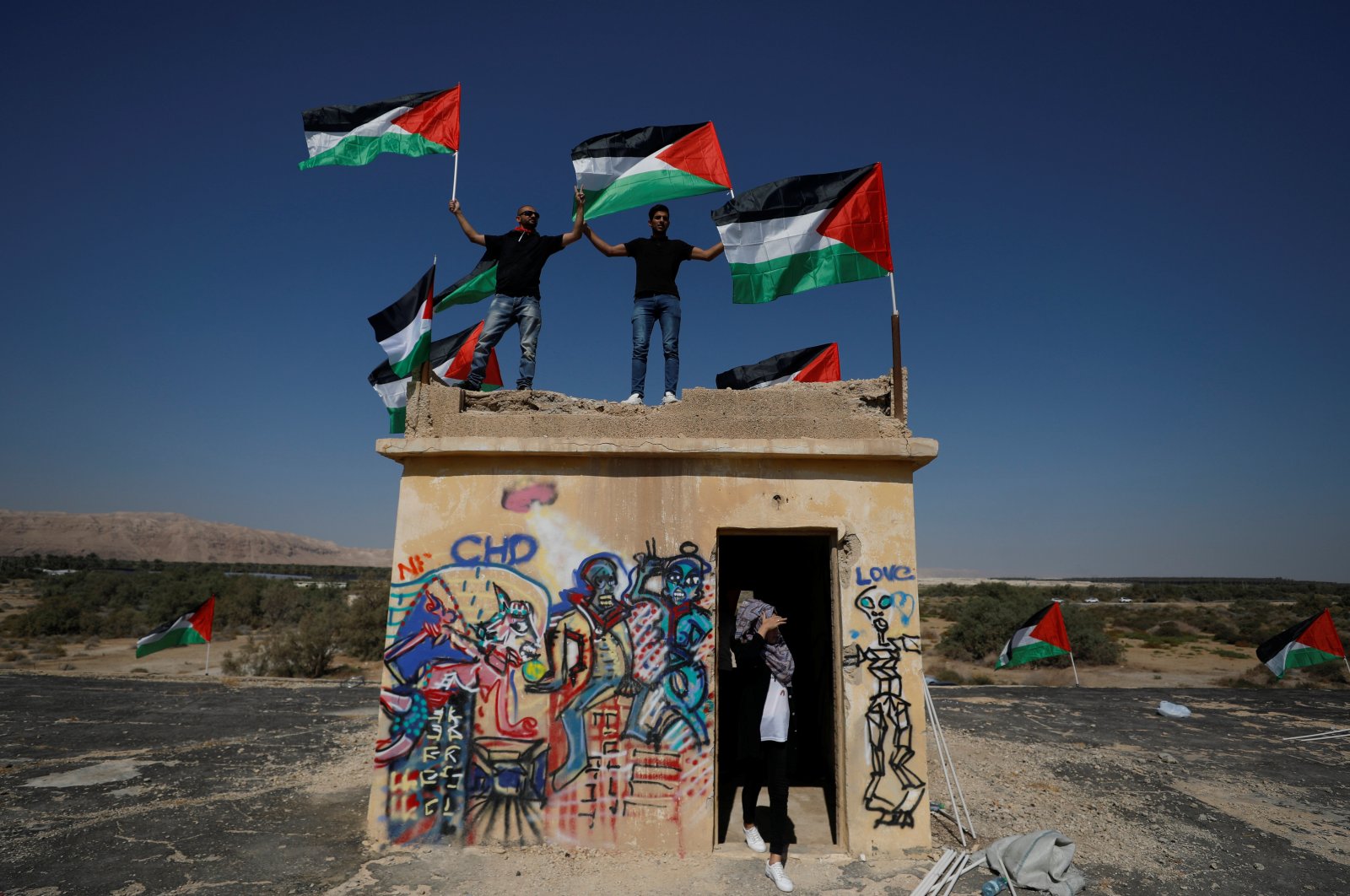 Demonstrators hold Palestinian flags during a protest against Jewish settlements near the Dead Sea in the Israeli-occupied West Bank, Sept. 28, 2019. (Reuters Photo)