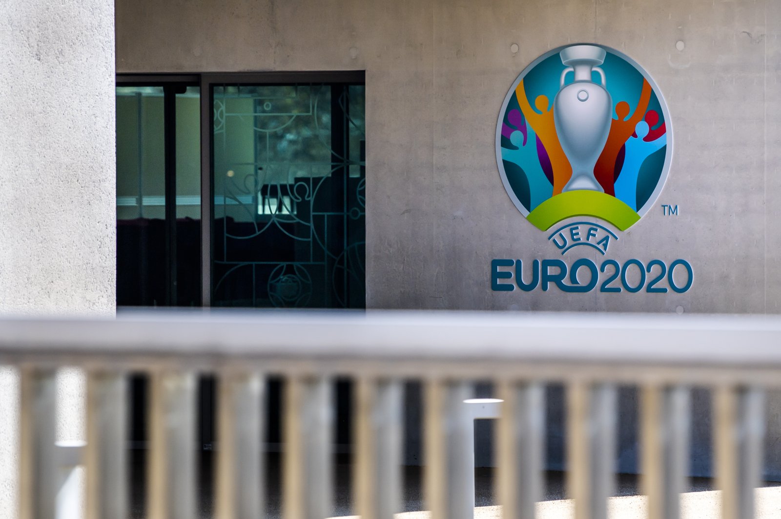 The Euro 2020 logo displayed next to the entrance of the UEFA Headquarters, in Nyon, Switzerland, Tuesday, March 17, 2020. (AP Photo)