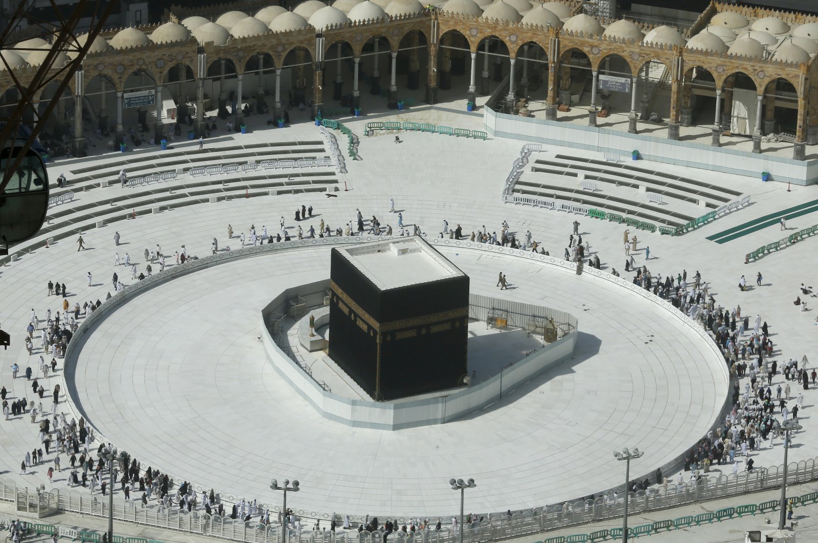 Muslims circumambulate the Kaaba, the cubic building at the Grand Mosque, in the Muslim holy city of Mecca, Saudi Arabia, Saturday, March 7, 2020. (AP Photo)