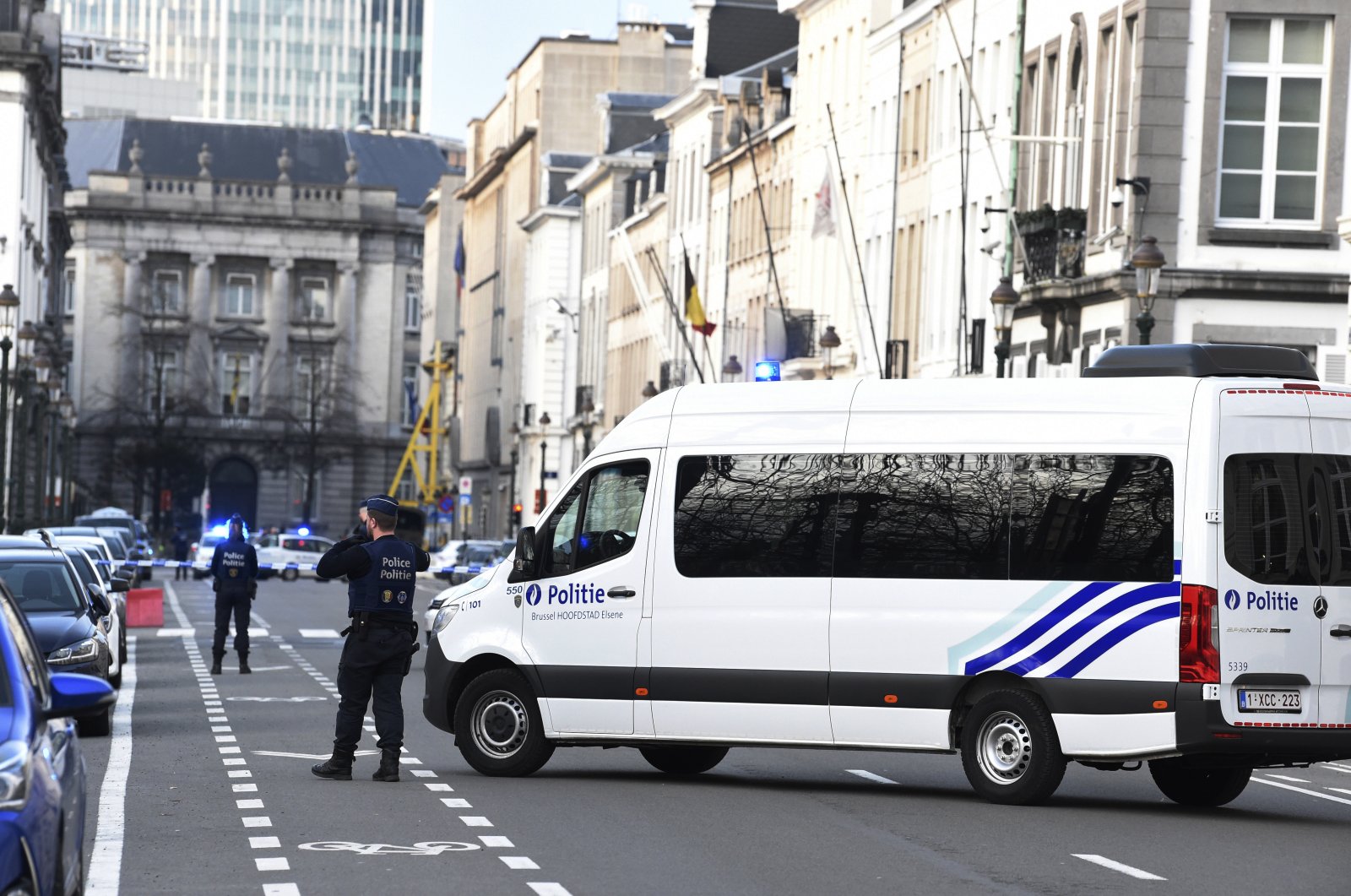 Belgian police has a street closed due to a suspicious car in front of 16 Rue de la Loi, the residence of Belgium's Prime Minister, during a National Security Council meeting at the premises in Brussels, Belgium, 17 March 2020. (EPA Photo)