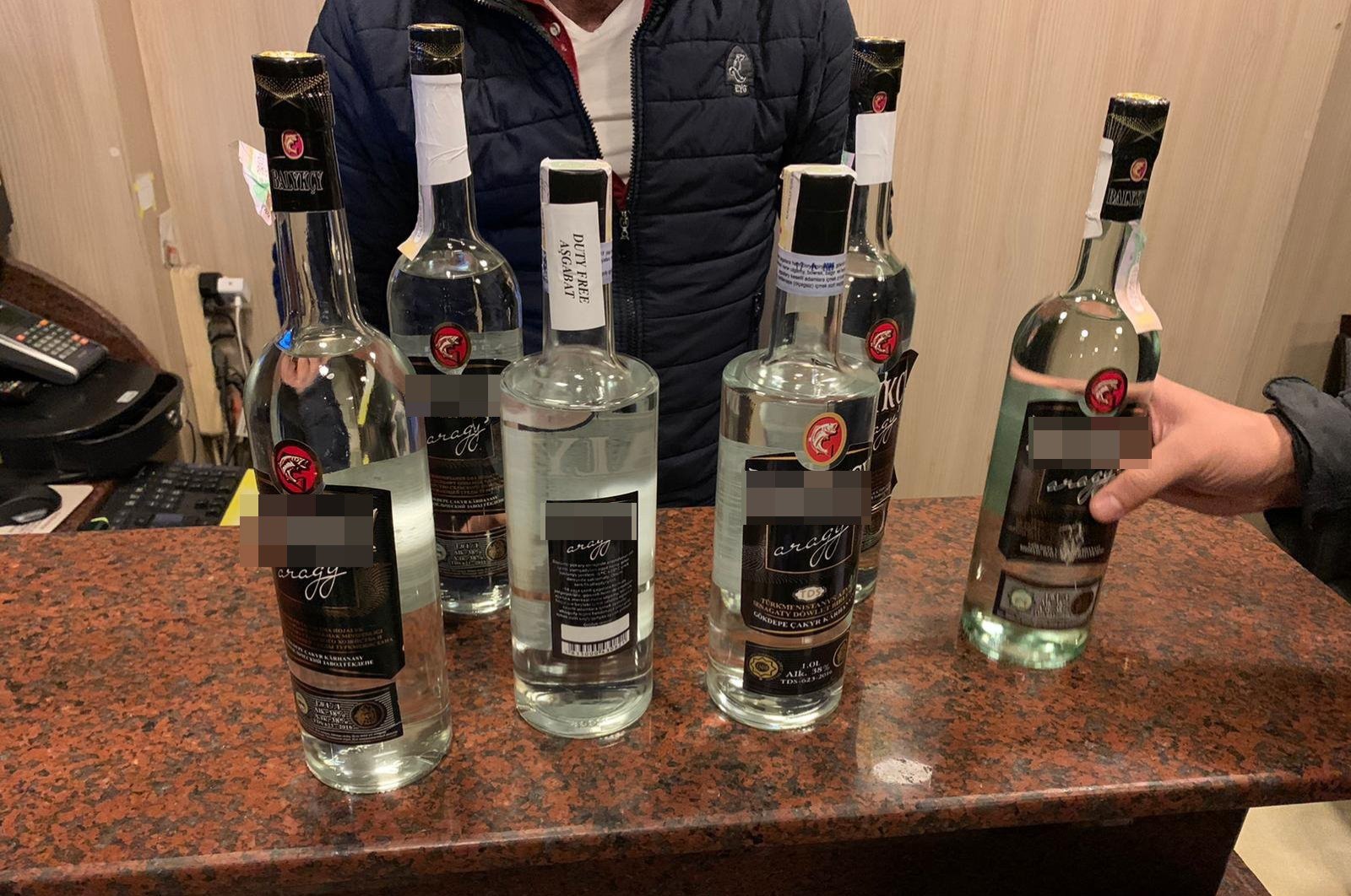 Bottles of fake liquor on display after they were seized in a police raid in Istanbul in this undated photo. (İHA Photo) 
