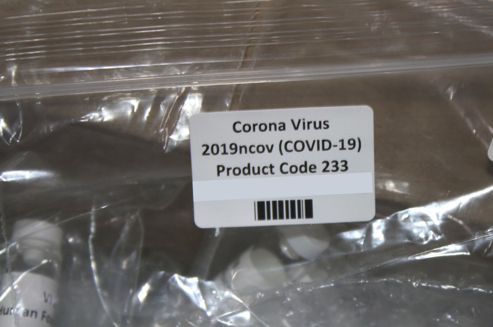 The U.S. Customs and Border Protection (CBP), shows a package containing suspected counterfeit COVID-19 test kits arriving from the U.K., March 12, 2020. (AP Photo)