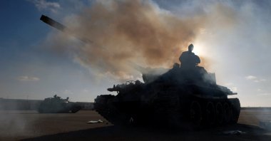 Members of forces loyal to warlord Khalifa Haftar get ready before heading out of Benghazi to reinforce the troops advancing to Tripoli, Benghazi, Libya, April 13, 2019 (REUTERS Photo)