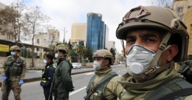 Jordanian army members stand guard at a check point after the start of a nationwide curfew, amid concerns over the coronavirus disease (COVID-19) spread, in Amman, Jordan March 21. (Reuters Photo)