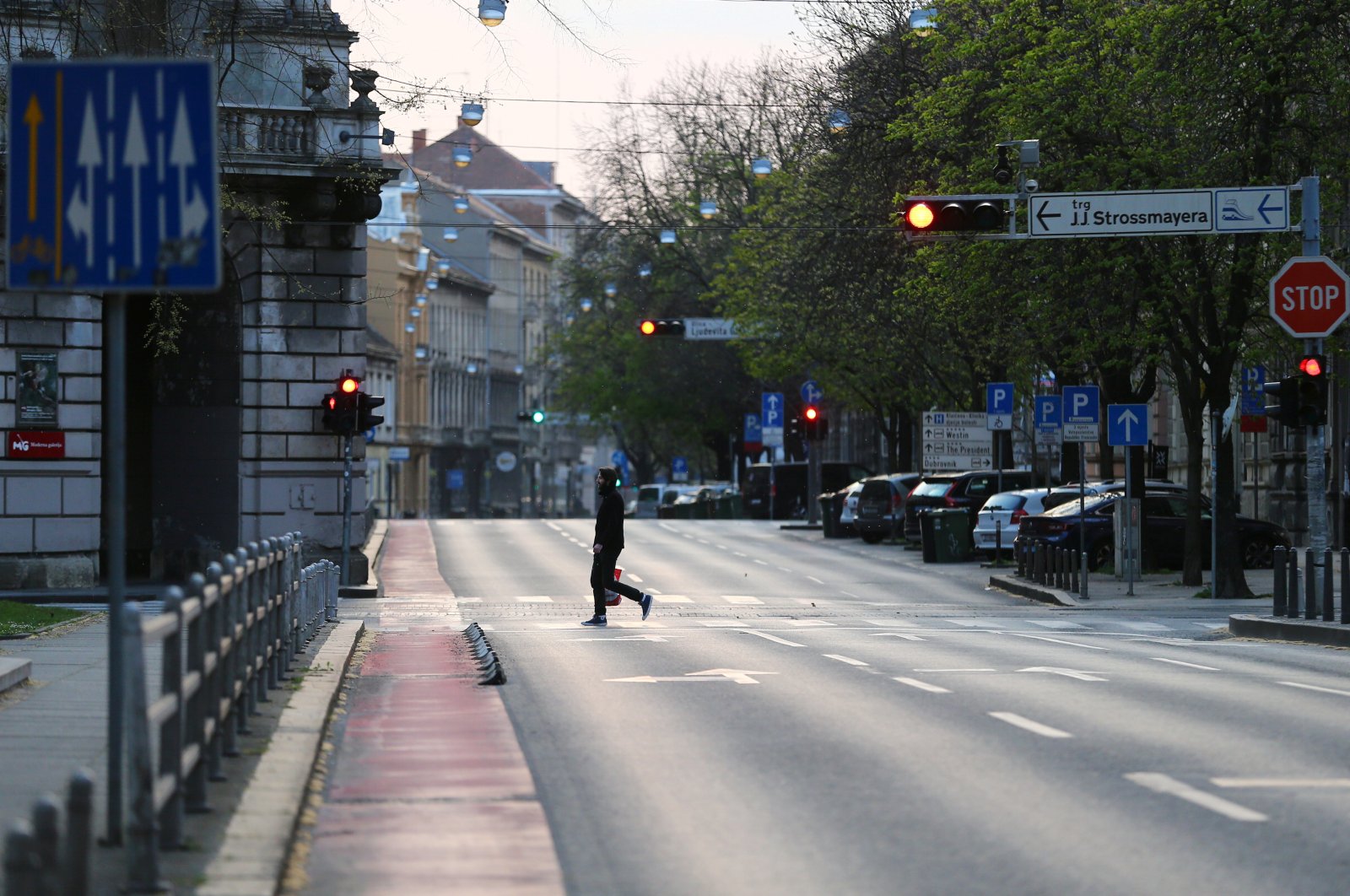 A man crosses a street in Zagreb, Croatia, where authorities have been stepping up measures to fight the coronavirus outbreak, March 21, 2020. (Reuters Photo)