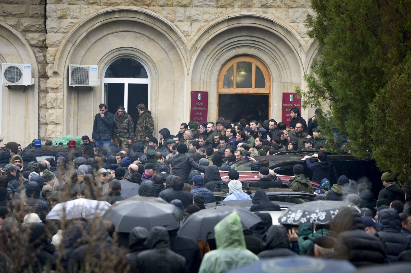 In this Jan. 9, 2020, file photo, protesters besiege the offices of Abkhazia President Raul Khadzhimba in the city of Sukhumi, in Georgia's breakaway province of Abkhazia. (AP Photo)