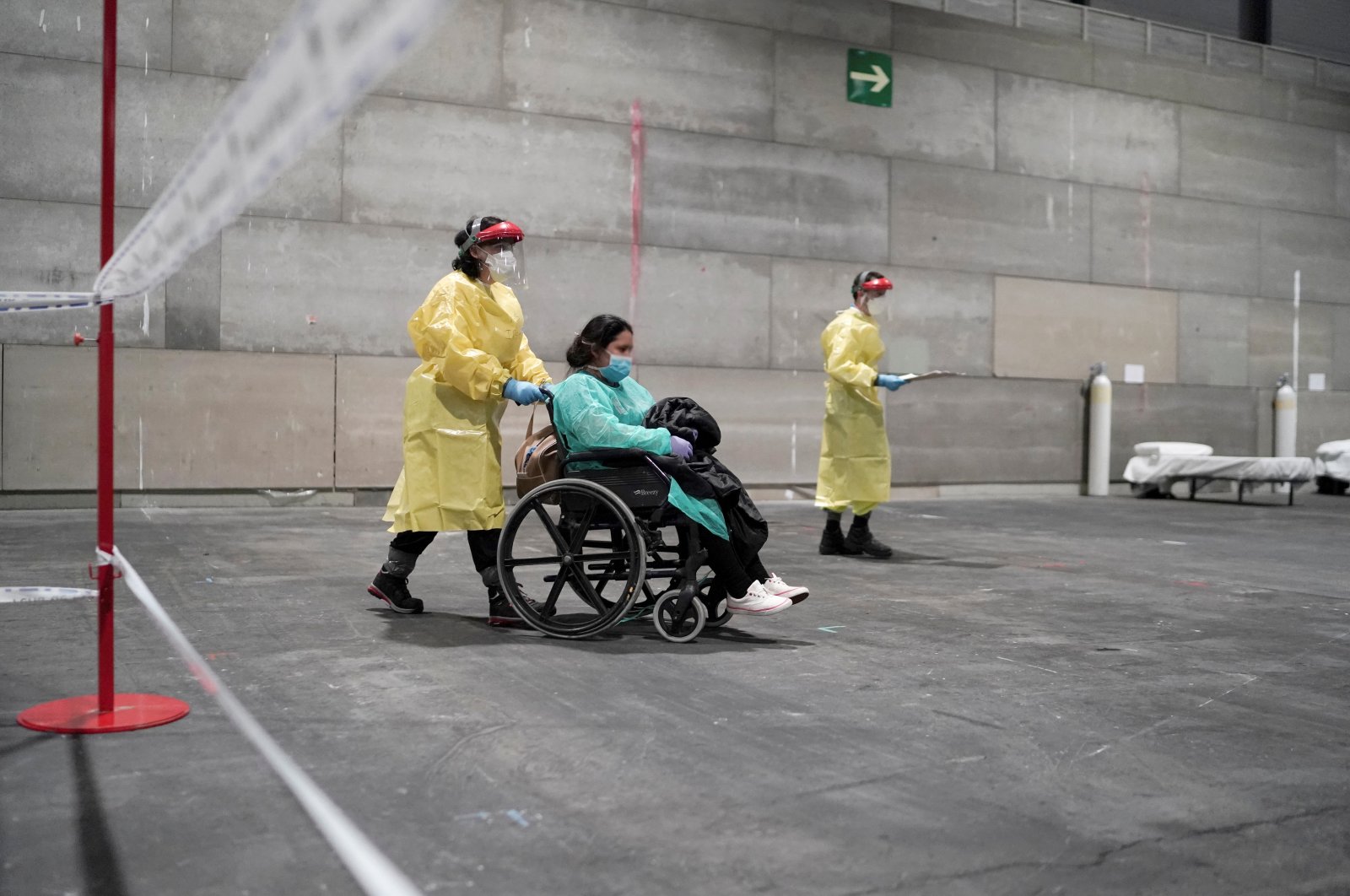 Coronavirus patients arrive at a military hospital set up at the IFEMA conference center in Madrid, Spain, March 21, 2020. Picture taken March 21, 2020. (Comunidad de Madrid/Handout via Reuters)