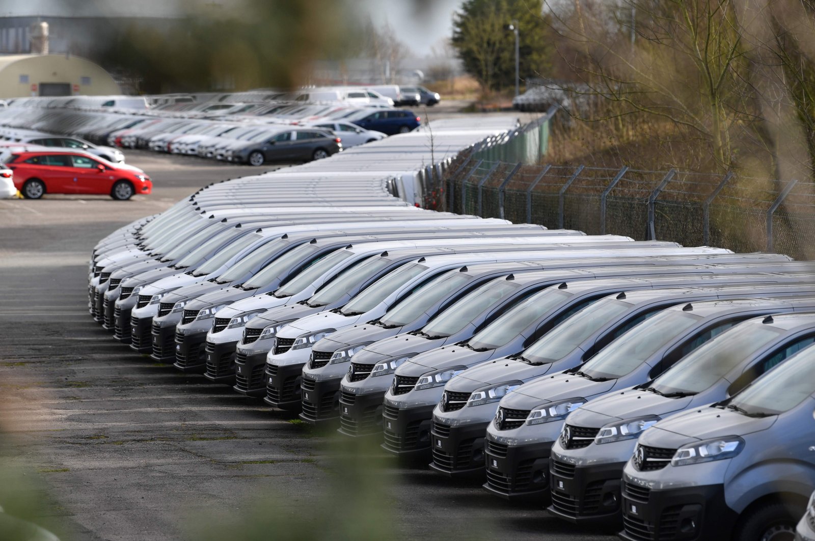 This picture shows cars parked at the Vauxhall factory in Ellesmere Port, east of Liverpool, after the owner, French automotive group PSA announced on March 16, 2020, the shutdown of all its factories in Europe during the week, due to the coronavirus. (AFP Photo)