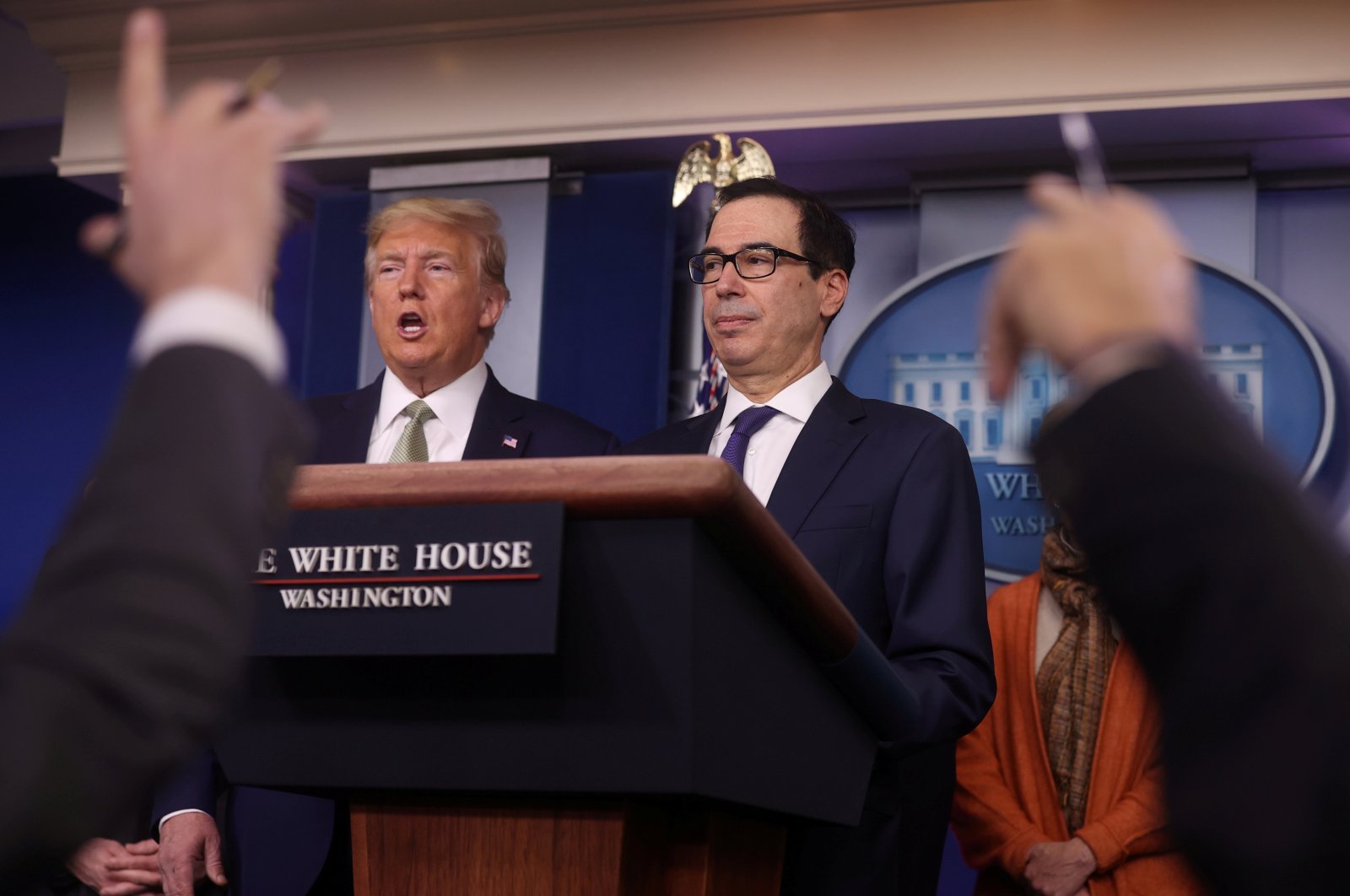U.S. President Donald Trump and Treasury Secretary Steven Mnuchin answer questions during the Trump administration's daily coronavirus briefing at the White House in Washington, U.S., March 17, 2020. (REUTERS Photo)