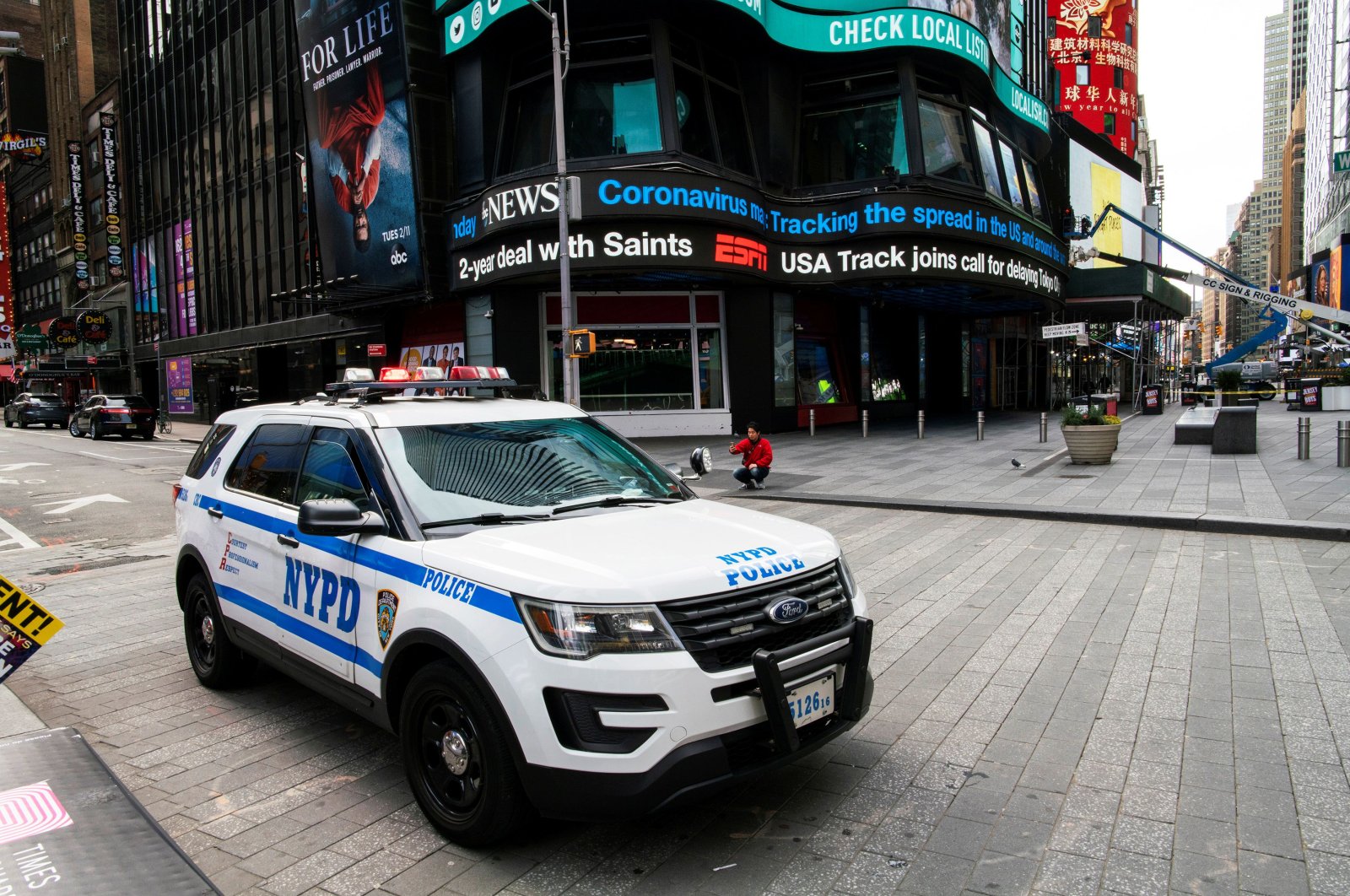 A NYPD police car stand guard at Times Square as the coronavirus disease (COVID-19) outbreak continues in New York, U.S., March 21, 2020. (Reuters Photo)