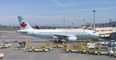 In this file photo, an Air Canada plane sits on the tarmac at Montreal-Pierre Elliott Trudeau International Airport near Montreal, Canada. (AFP Photo)