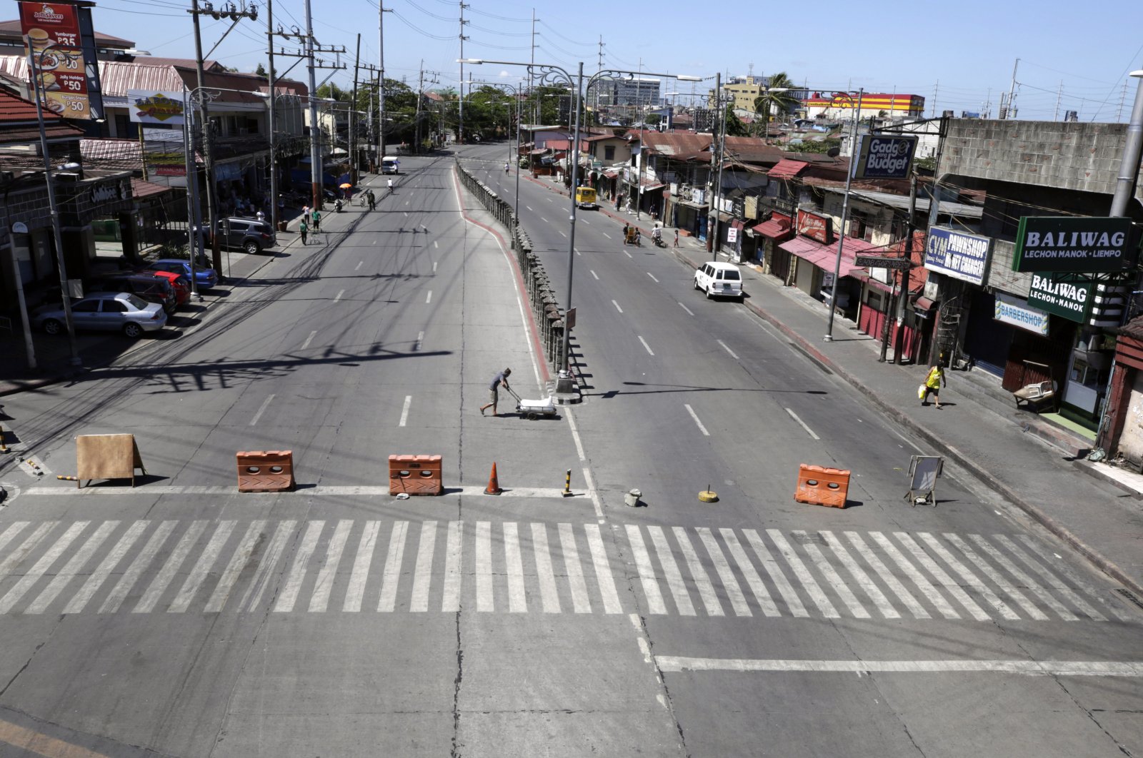 View of an empty road in Bacoor, Philippines, March 23, 2020. (EPA Photo)