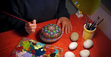 All you need for stone painting are brushes and acrylic paints. (iStock Photo)