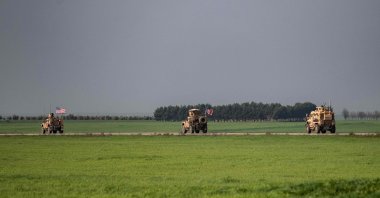 U.S. forces patrol around the M4 highway between Qamishli and the city of Hasakeh in northeast Syria, Tuesday, March 17, 2020. (AFP Photo)
