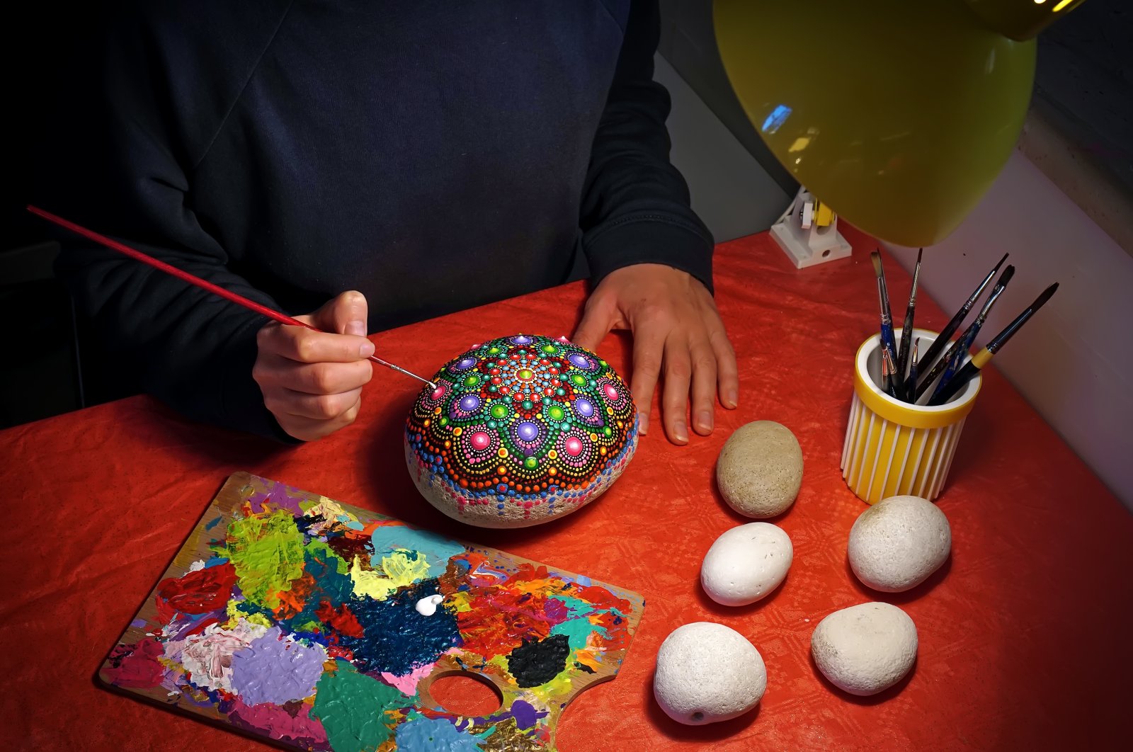All you need for stone painting are brushes and acrylic paints. (iStock Photo)