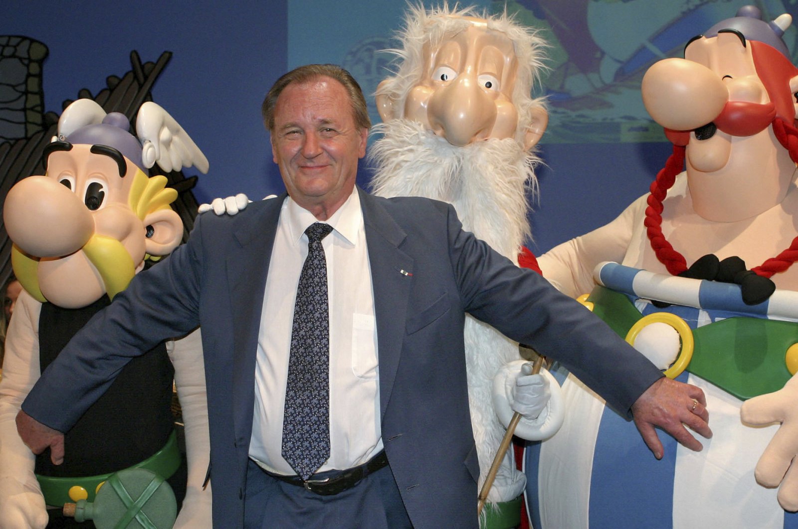 In this June 12, 2004 file photo, French illustrator Albert Uderzo poses with characters of his famous comics, Asterix, left, druid Miraculix, behind, and Obelix , right, during the awarding of the so-called "Max & Moritz" award by the Erlangen Comic Salon2004 in Erlangen, southern Germany. (AP Photo)