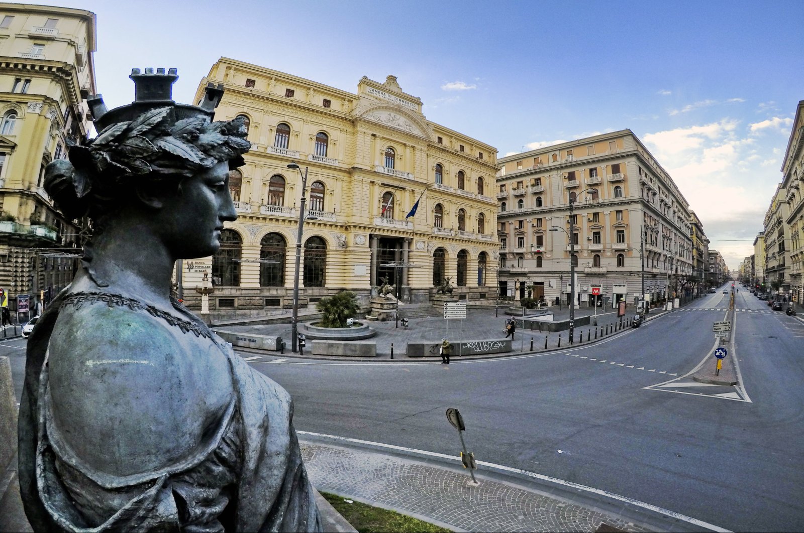 The statue of Goddess Phartenope seems to look down the street Corso Umberto in Naples, Italy, 24 March 2020, where the road is normally full of cars and now semi-deserted due to the blocking of the circulation wanted by the Government to stem the danger of contagion from coronavirus (EPA Photo)