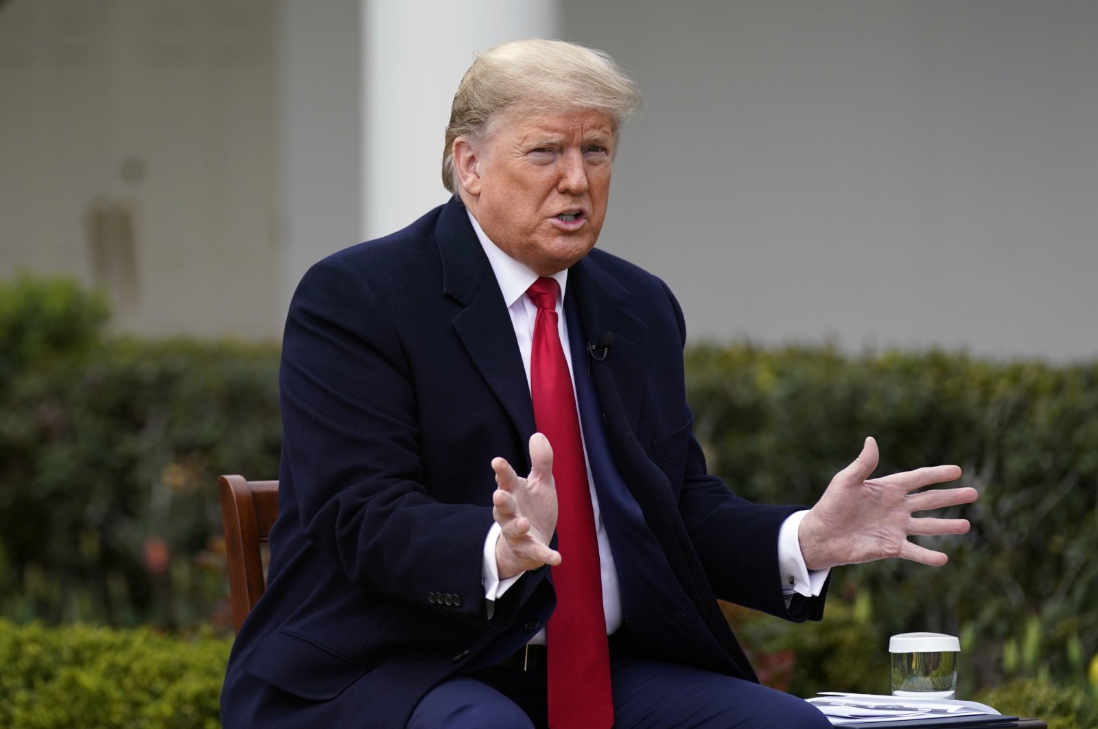 President Donald Trump speaks with Fox News Channel Anchor Bill Hemmer during a Fox News Channel virtual town hall, at the White House, Tuesday, March 24, 2020, in Washington. (AP Photo)