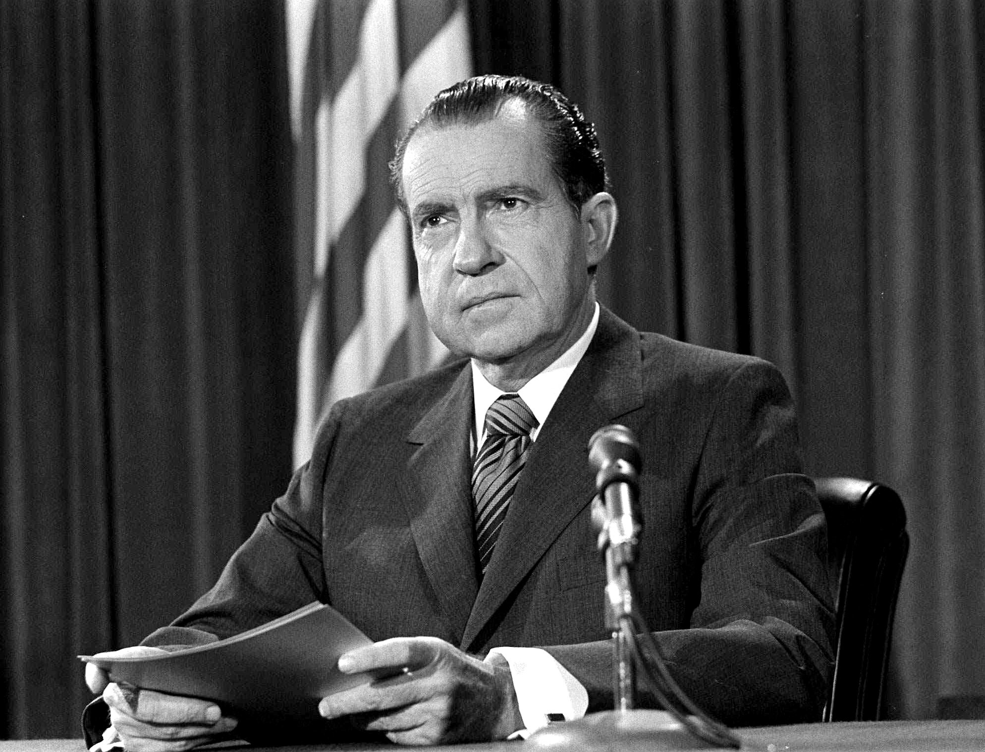 President Nixon poses at his White House desk in this March 23, 1970 file photo. (AP Photo)