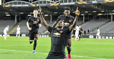 Manchester United's Odion Ighalo celebrates after scoring the opening goal during a Europa League match against Linzer ASK in Linz, Austria, Thursday, March 12, 2020. (AP Photo)