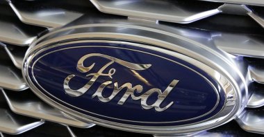 This Feb. 15, 2018, photo shows a Ford logo on display at the Pittsburgh Auto Show in Pittsburgh. (AP Photo)