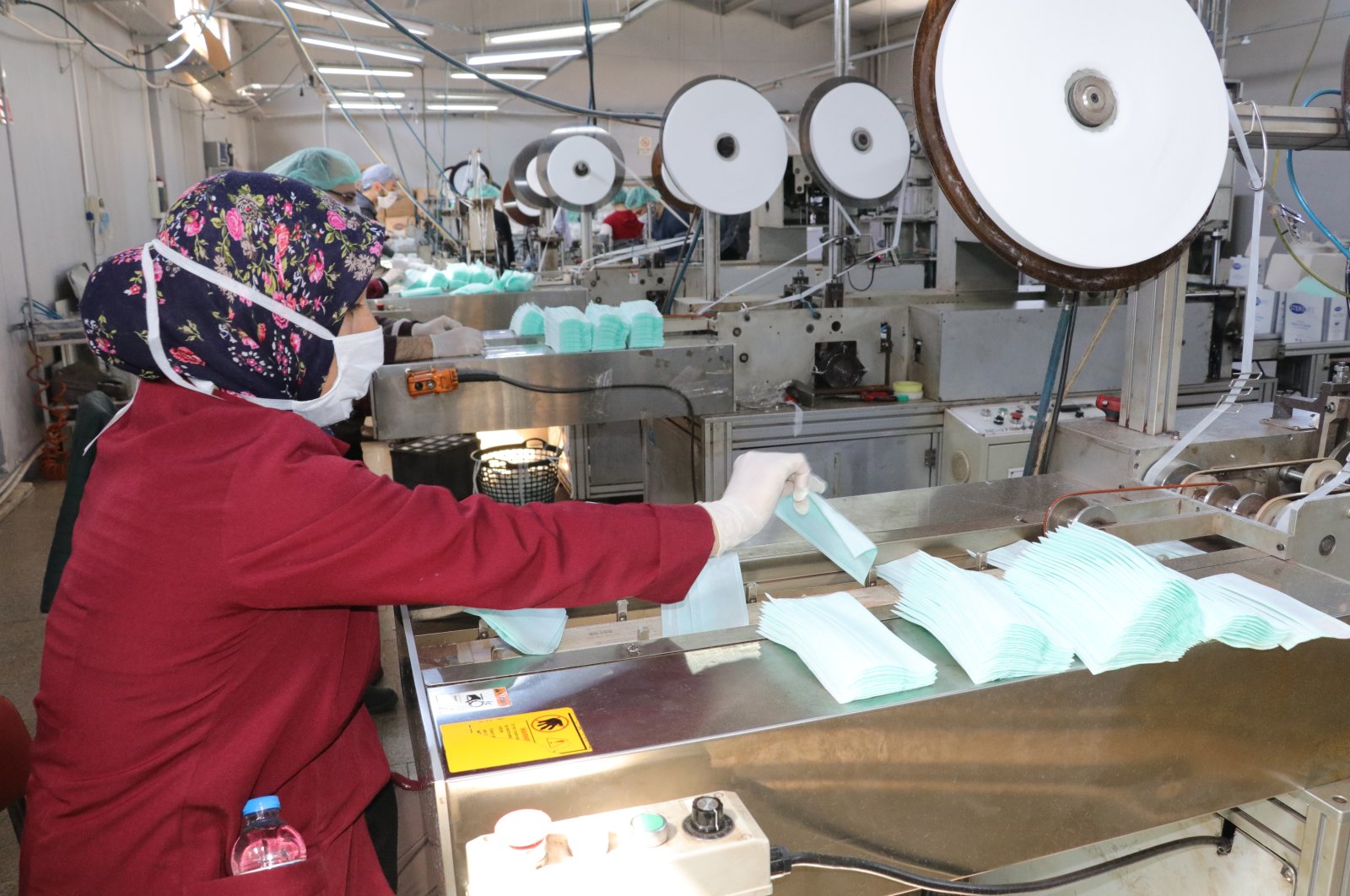 Workers are seen in a firm that manufactures health supplies in Turkey's central province of Yozgat, Wednesday, March 25, 2020. (AA Photo)